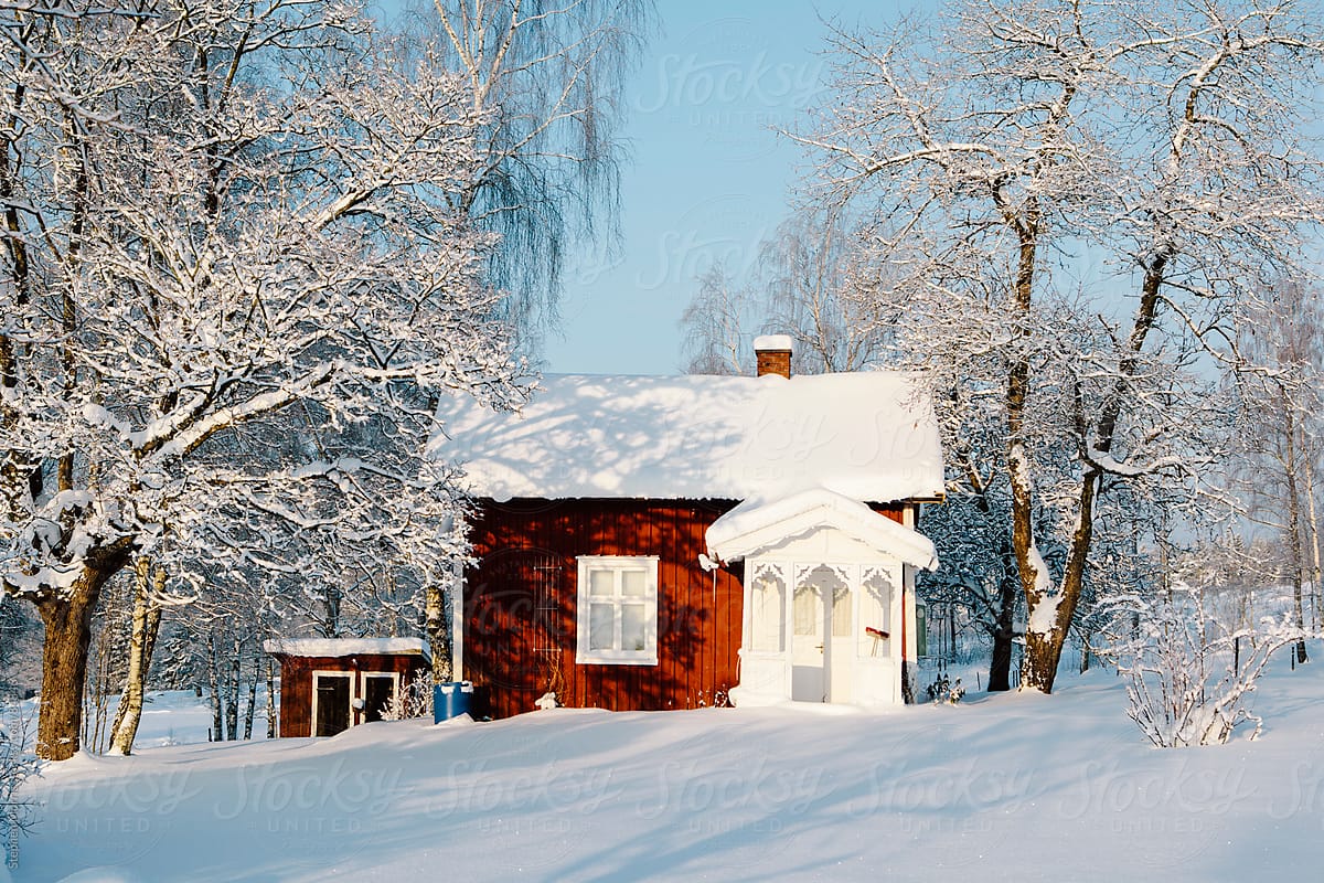 Red Swedish Cottage in Snowy Landscape