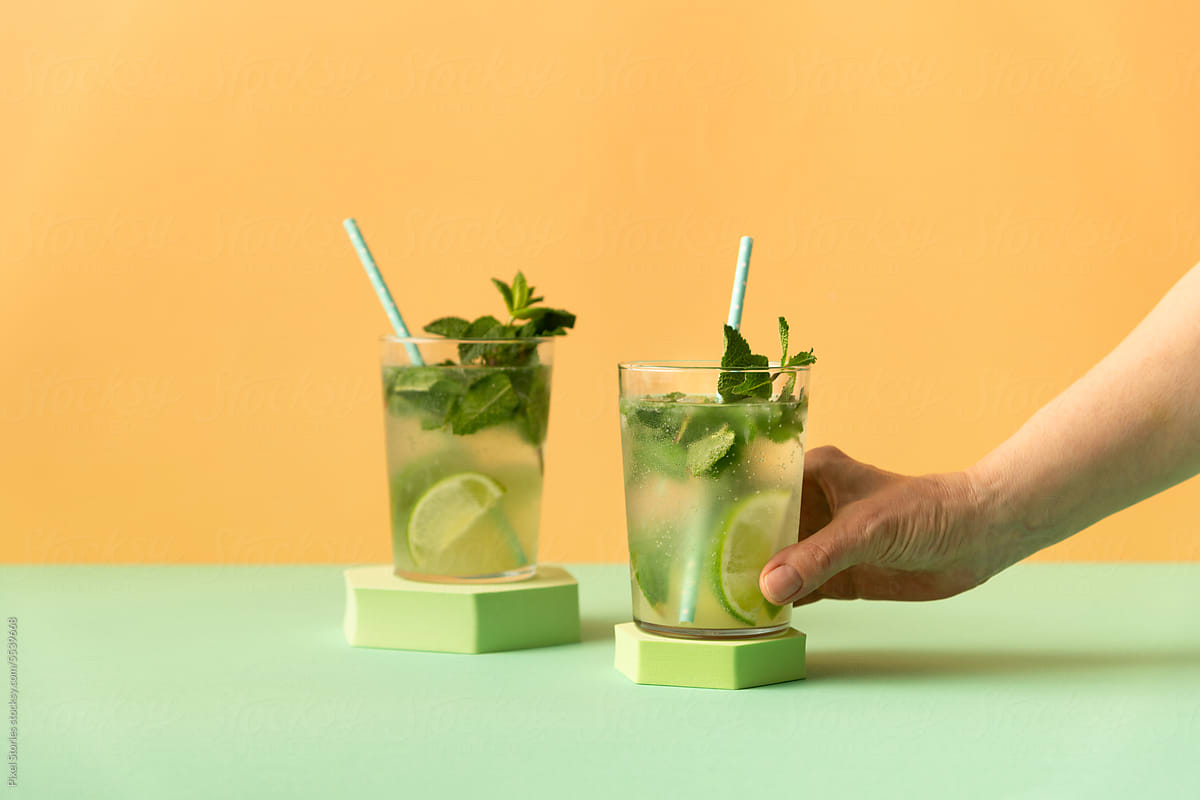 Classic rum mojito cocktail on colorful background