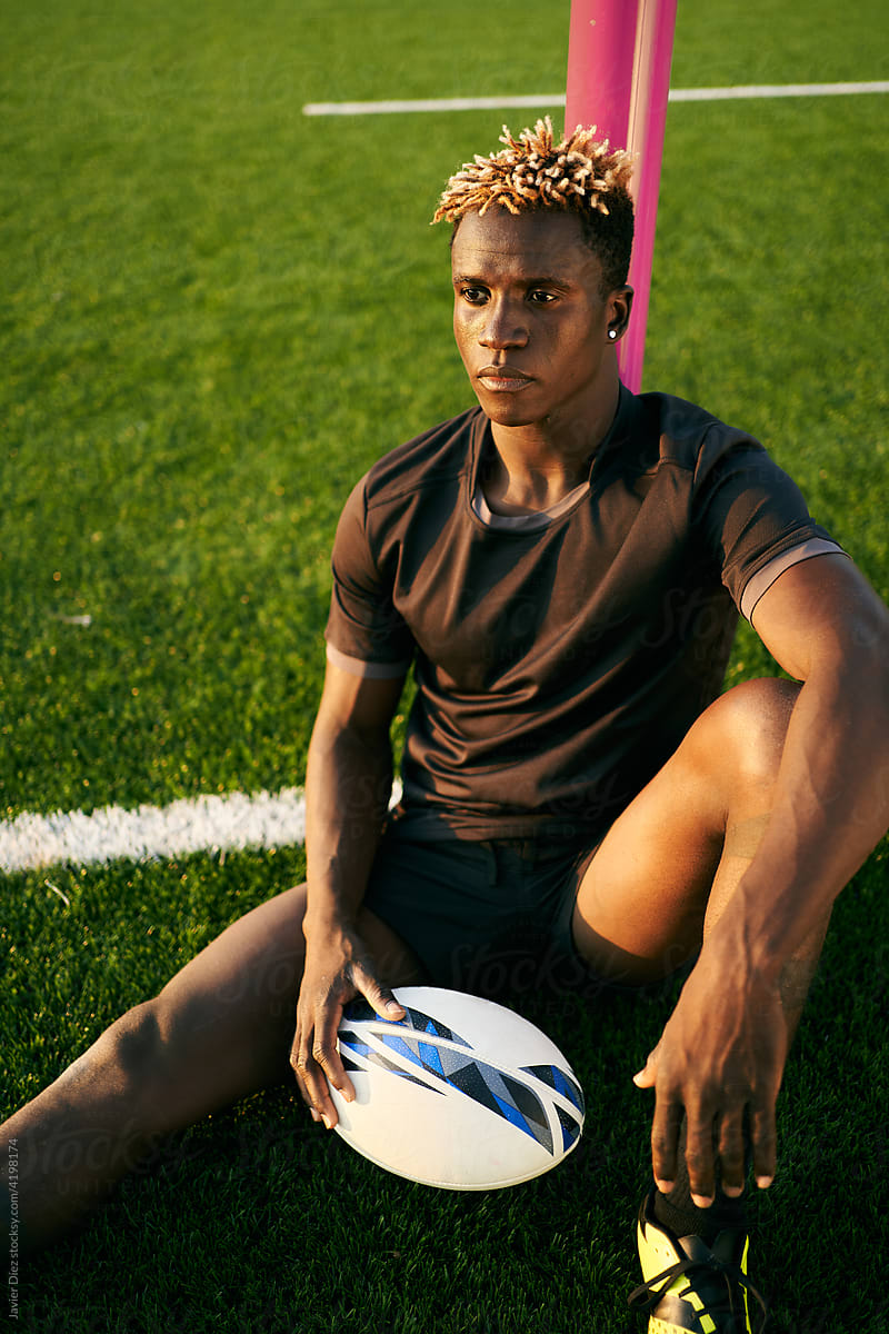 Black rugby player on sports field