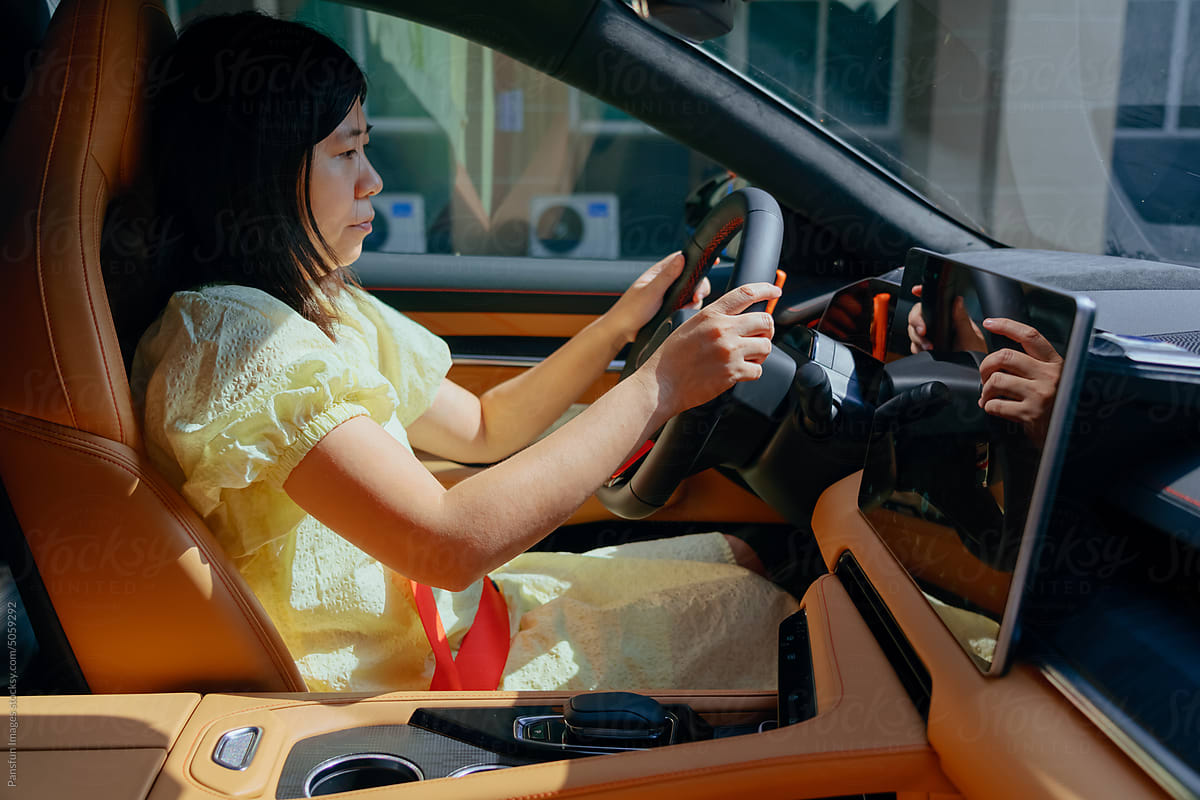 woman in modern electric car