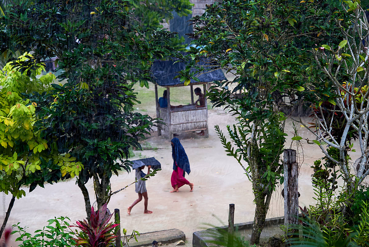 Heavy rain downpour in Solomon Islands village, global south Pacific