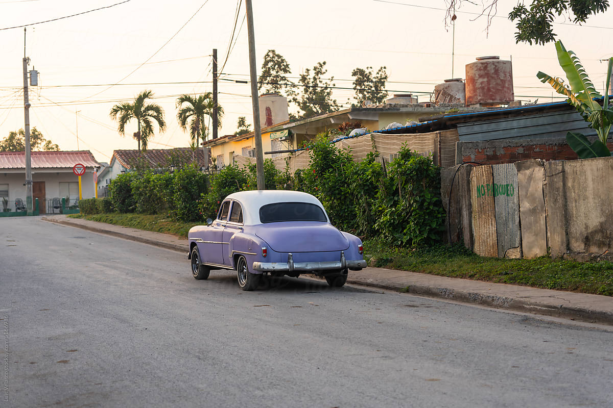 Purple Vintage Vehicle Parked On The Street
