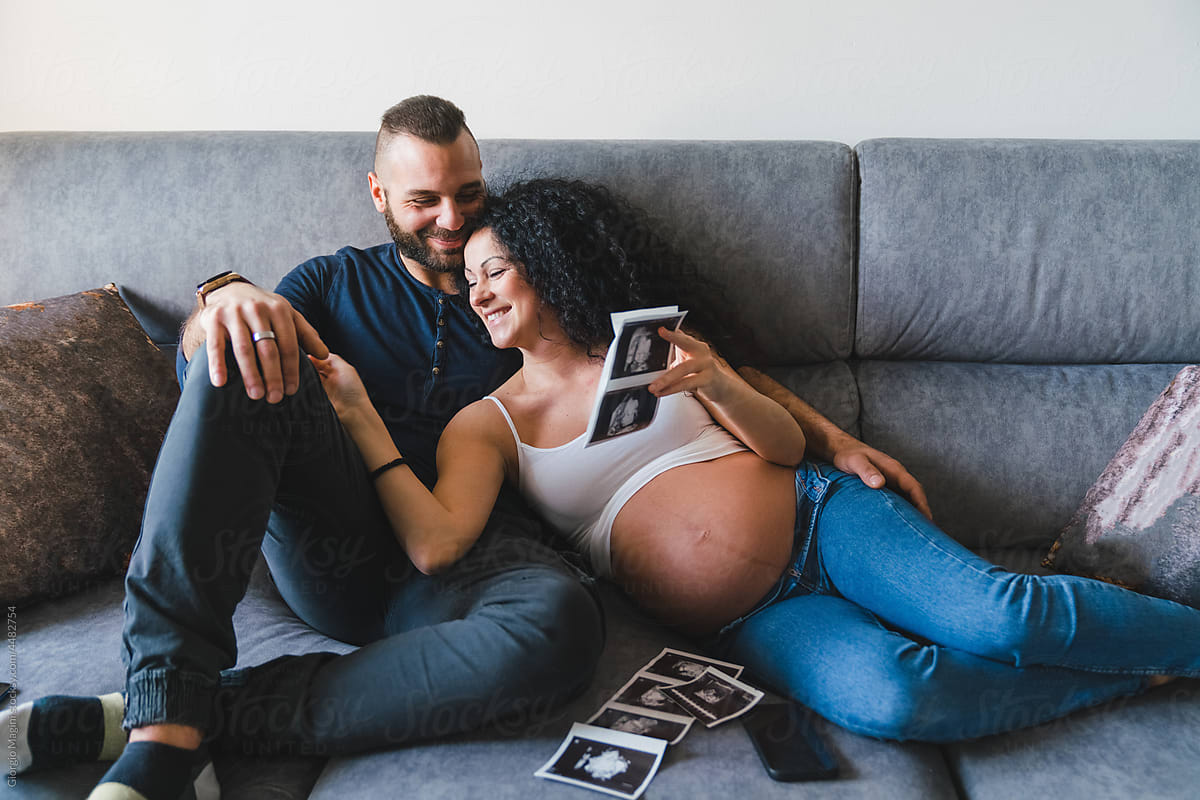 Happy Pregnant Couple with Baby Ultrasound Scans