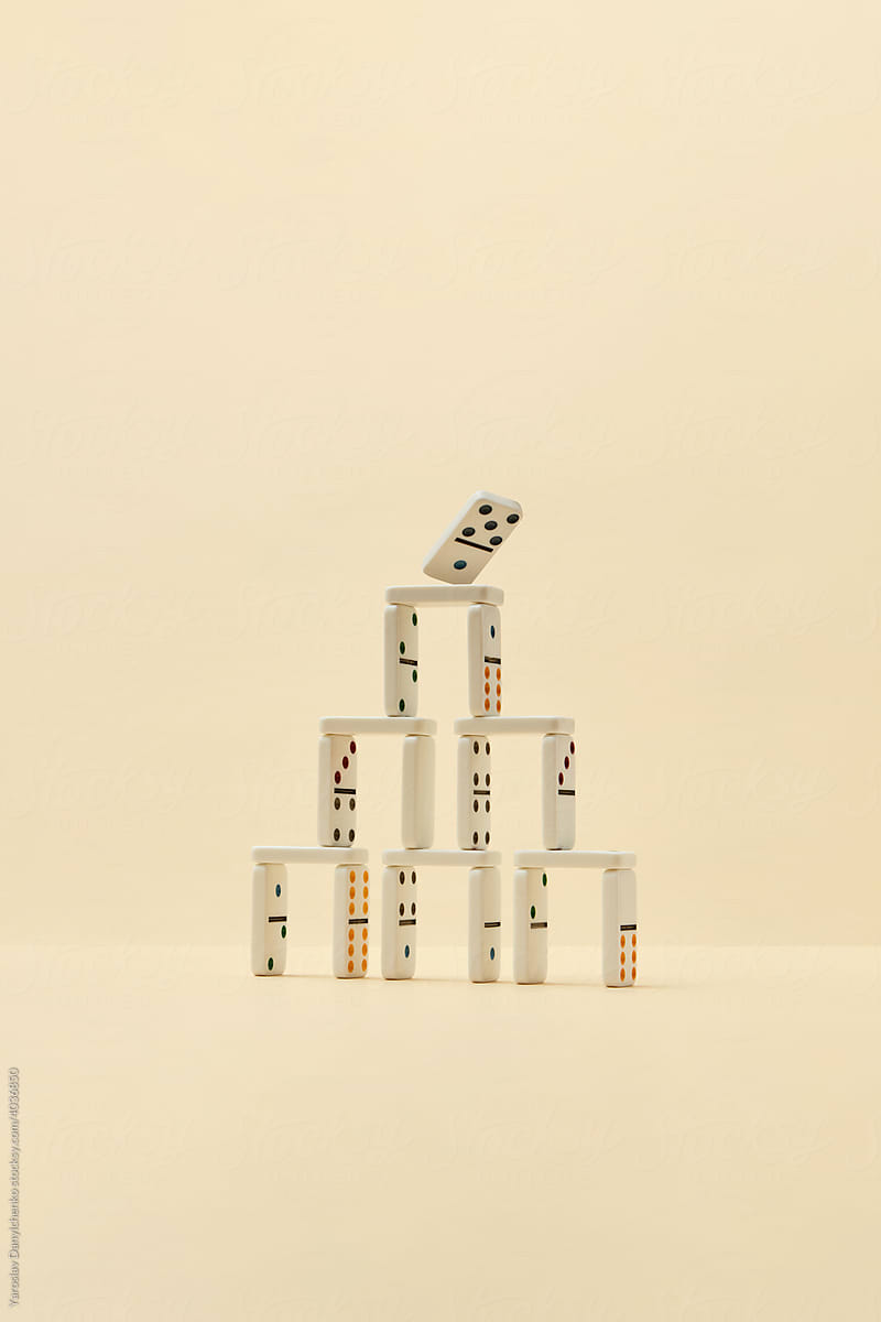 Domino pyramid with falling piece