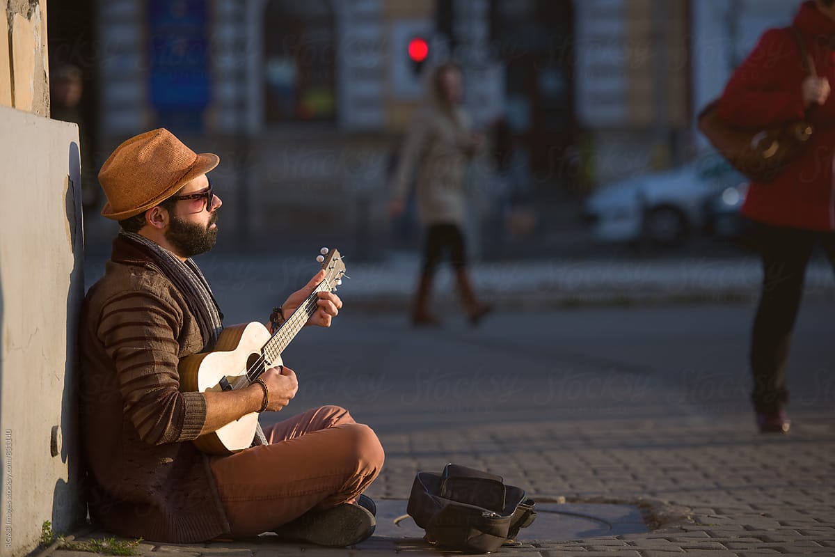 Musician playing ukulele on the street