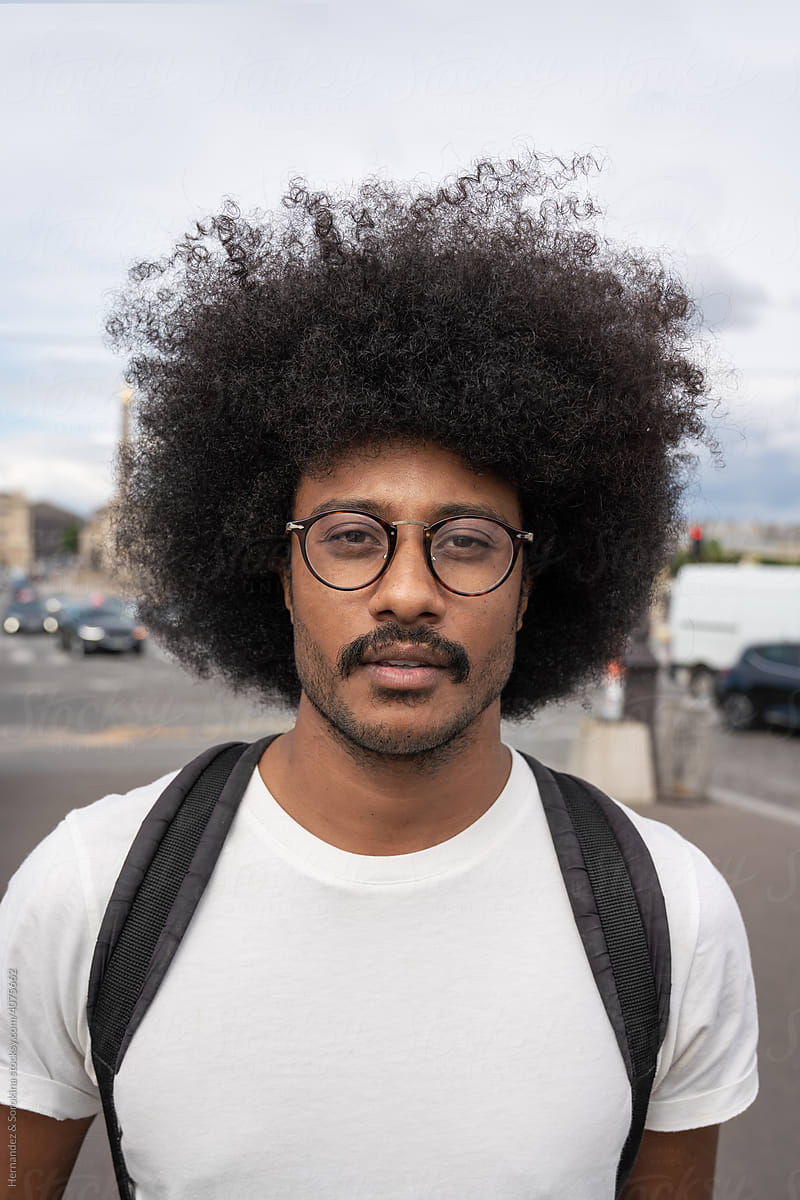 Portrait Of Hipster With Afro Hair Outdoors