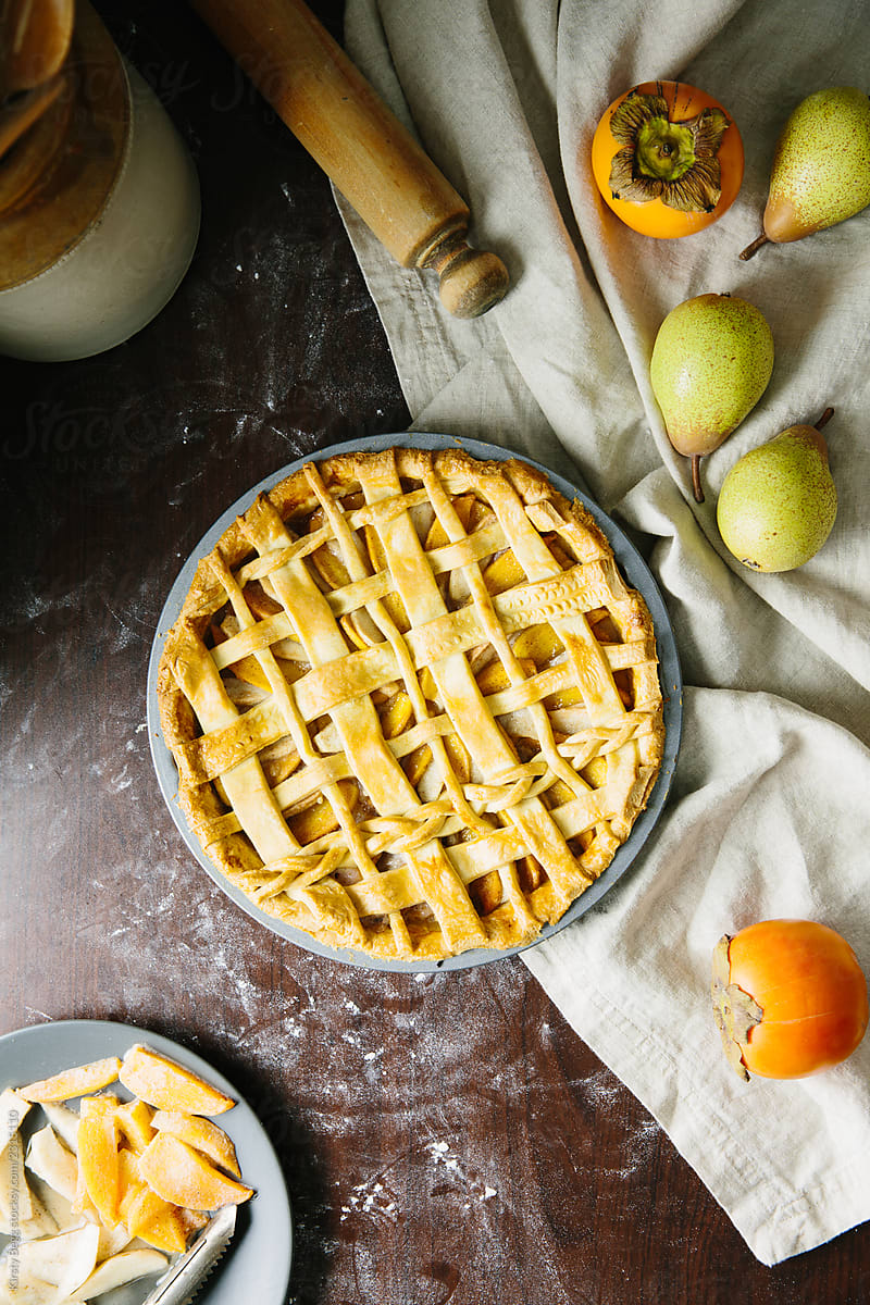 Baked persimmon and pear pie with lattice top