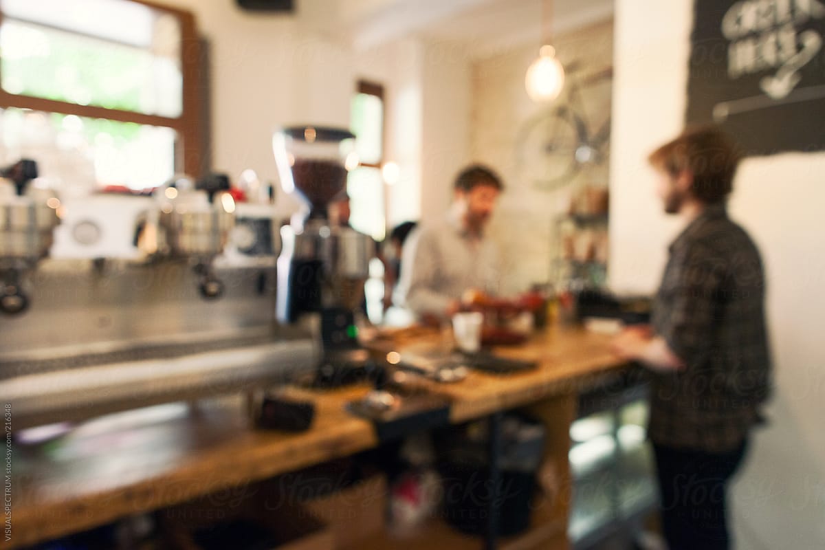 Customer and Cashier in Coffee Shop Defocused