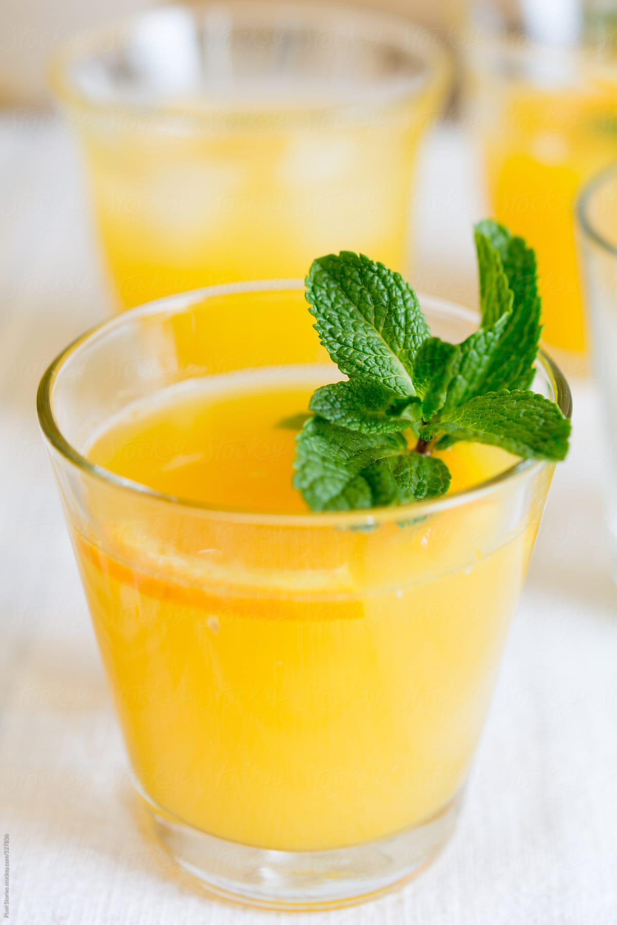 Drinks: close-up of glass full of fresh orange juice