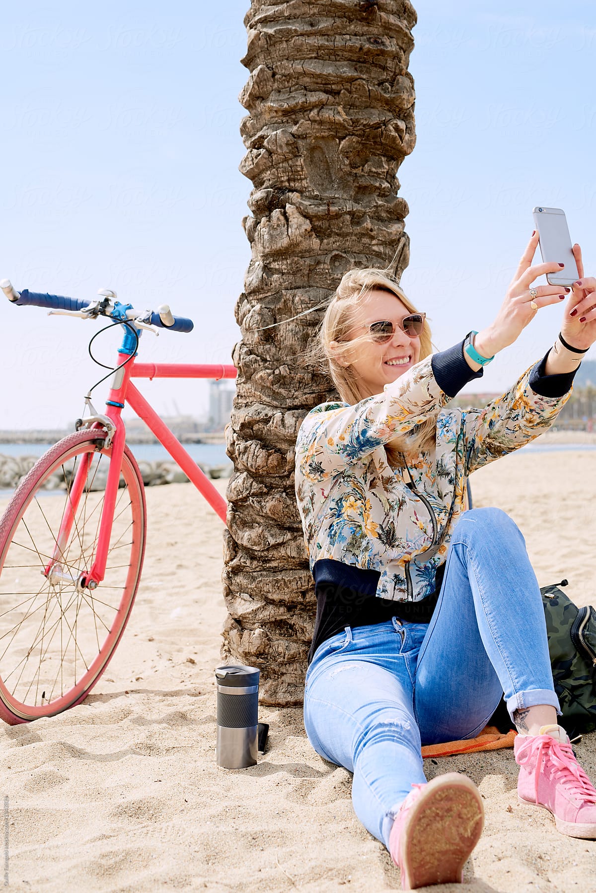 Woman In Sunglasses Taking Selfie On Beach With Fixie By Stocksy Contributor Guille Faingold 