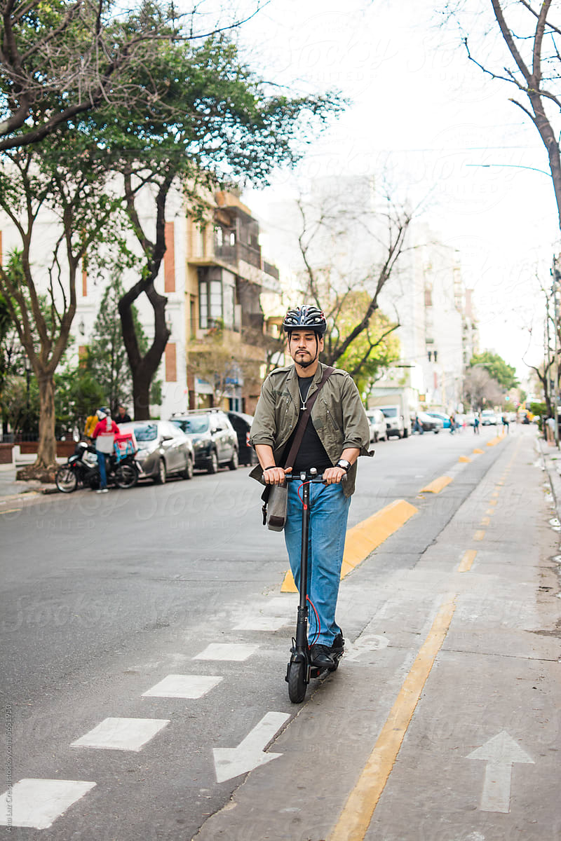 Man riding scooter