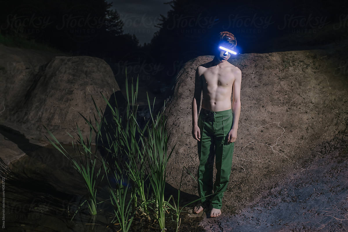 conceptual portrait of a teenager in a VR helmet in the metaverse