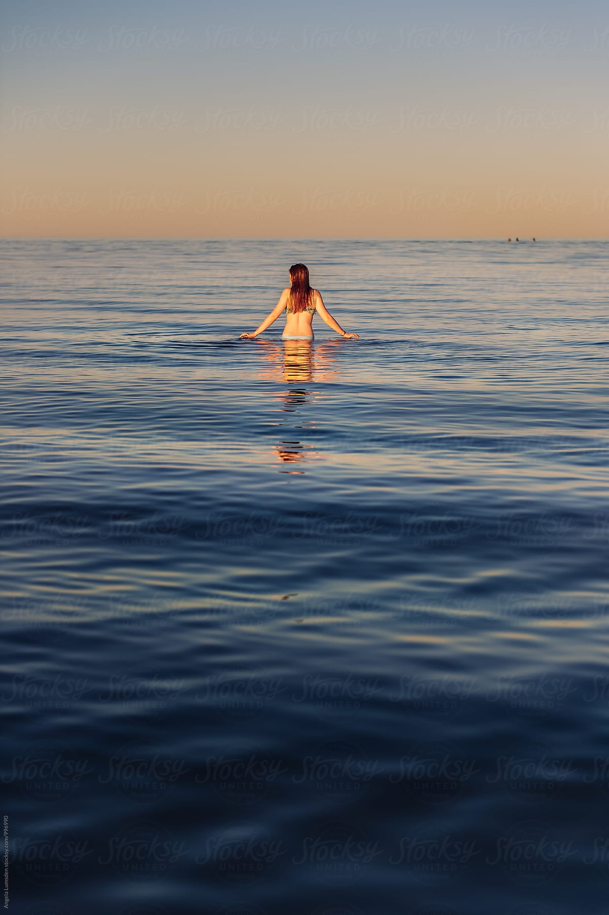 Girl Walking In Water At Sunset Porangela Lumsden