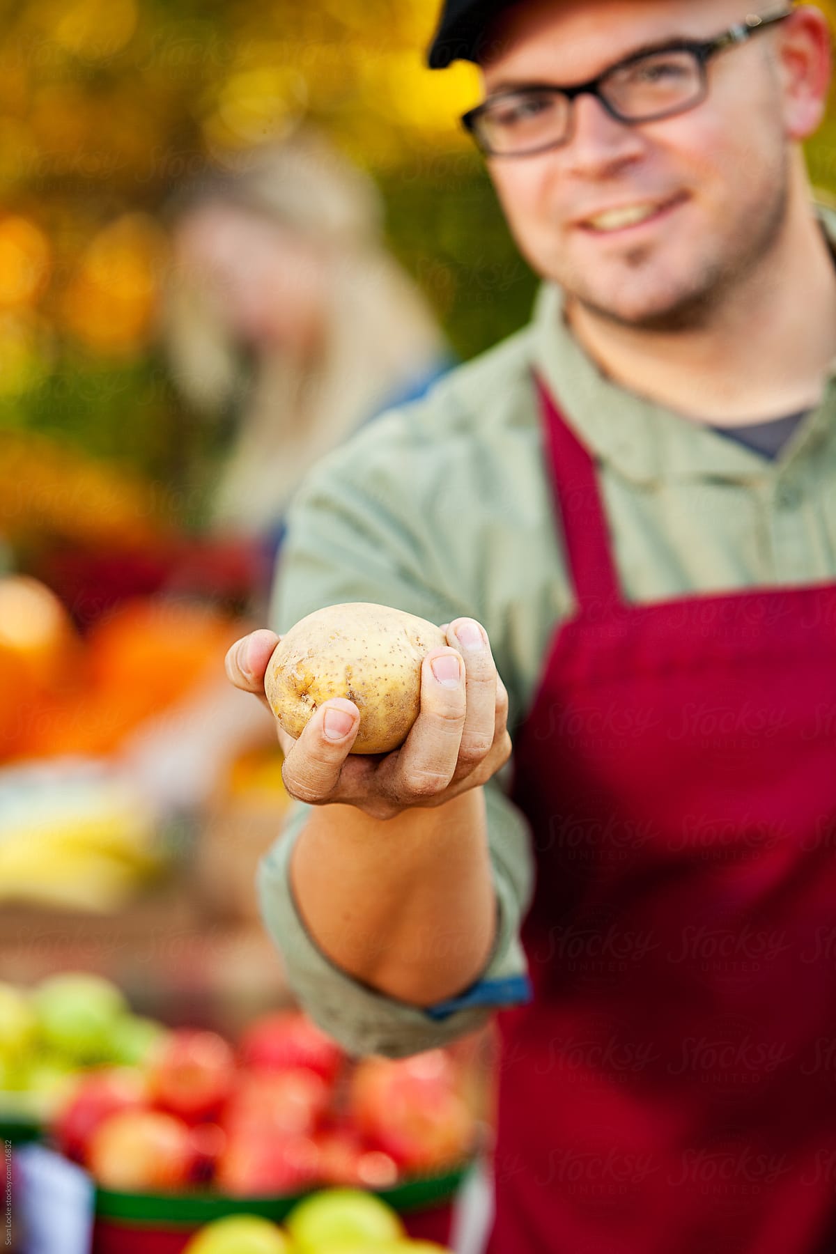 Farmer\'s Market: Focus on Potato in Hand