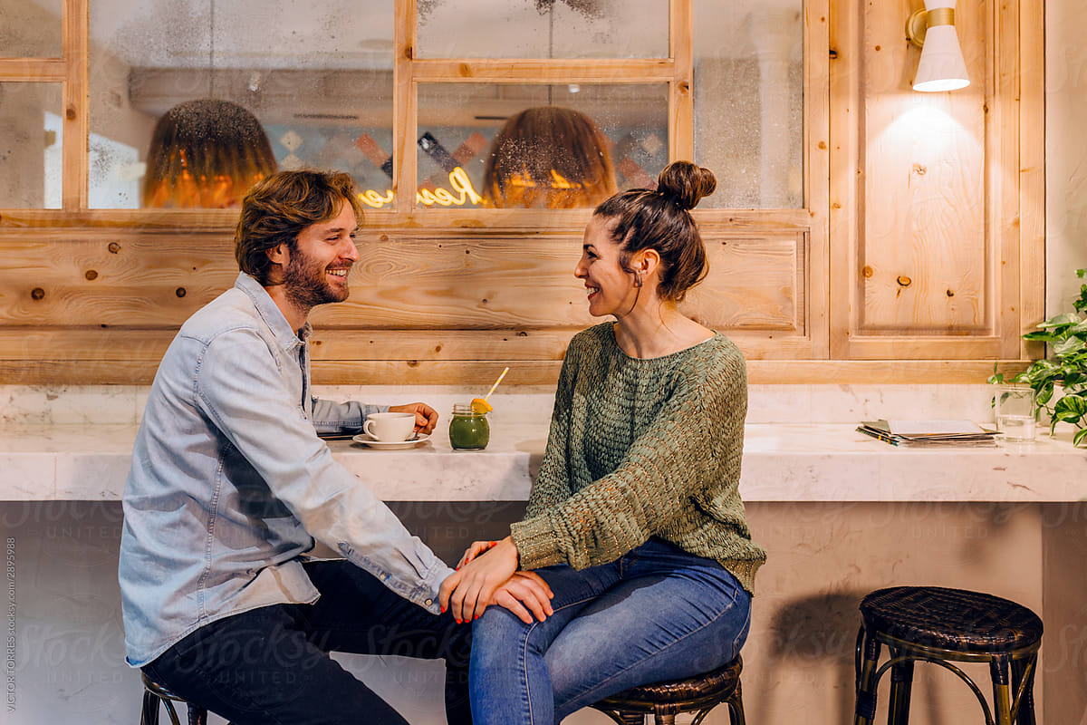 Affectionate couple enjoying time together in cafe