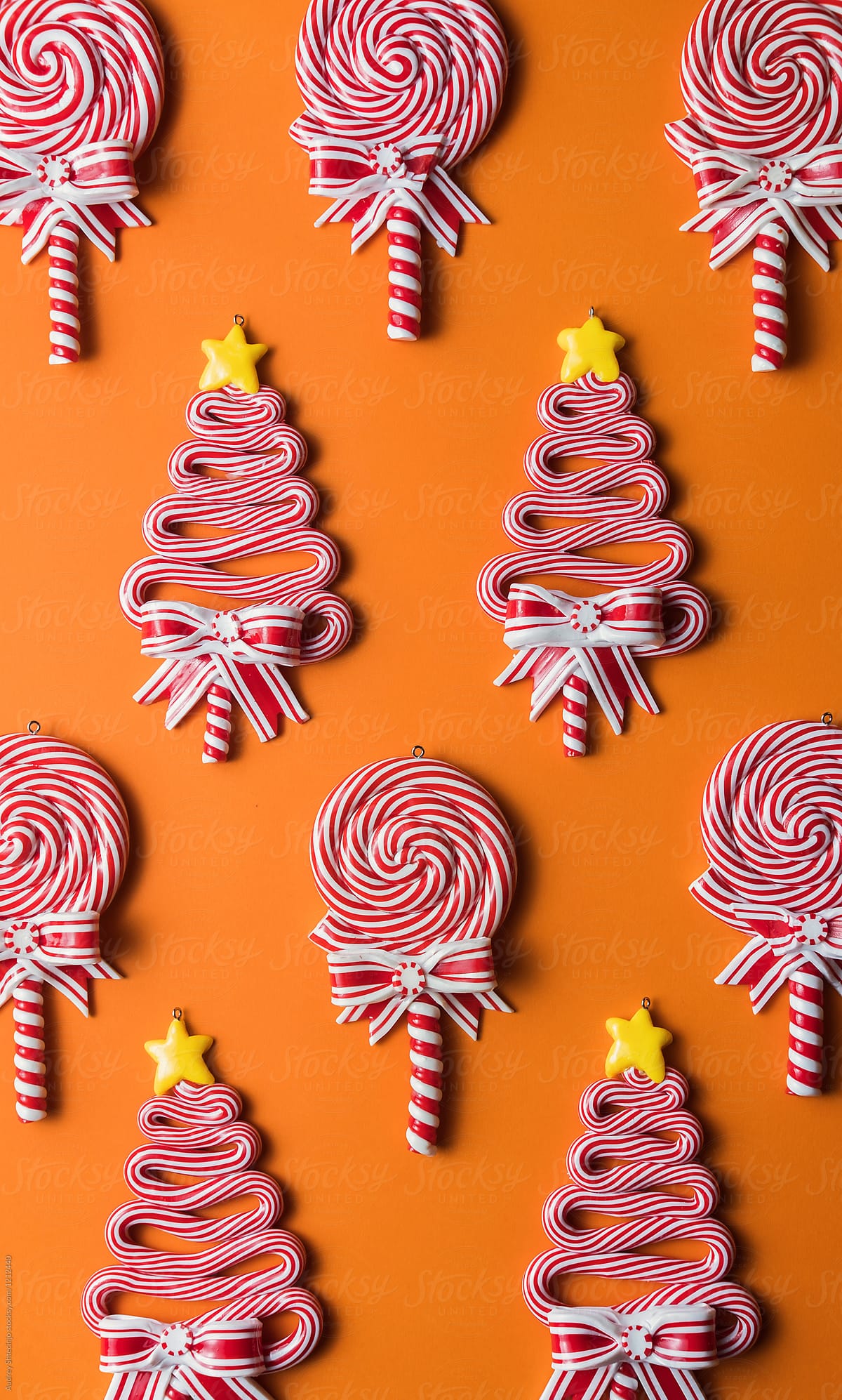 Various/Lollipop sweets decorations and small presents on orange background