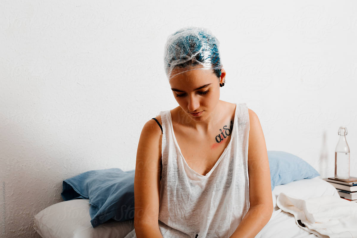 Androgyne model with blue dye at bedroom