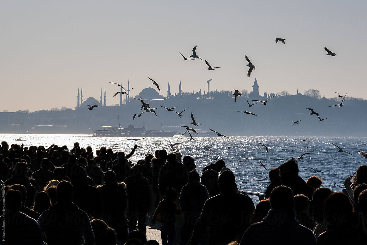 The crowded asian seashore overlooking the bosphorus strait and the historical district