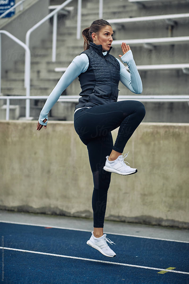 Woman doing warmup exercises before running