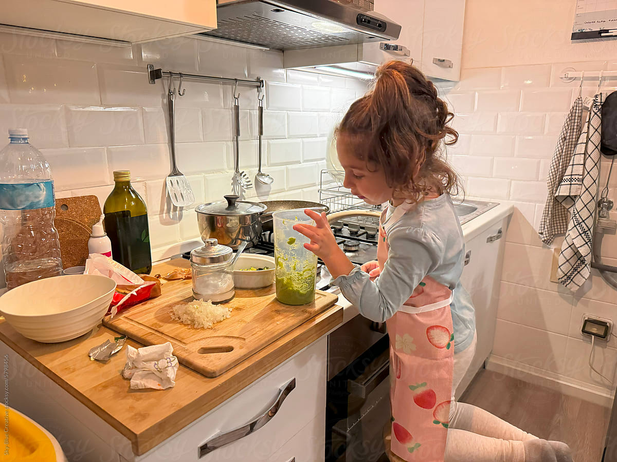 Little girl cooking at home