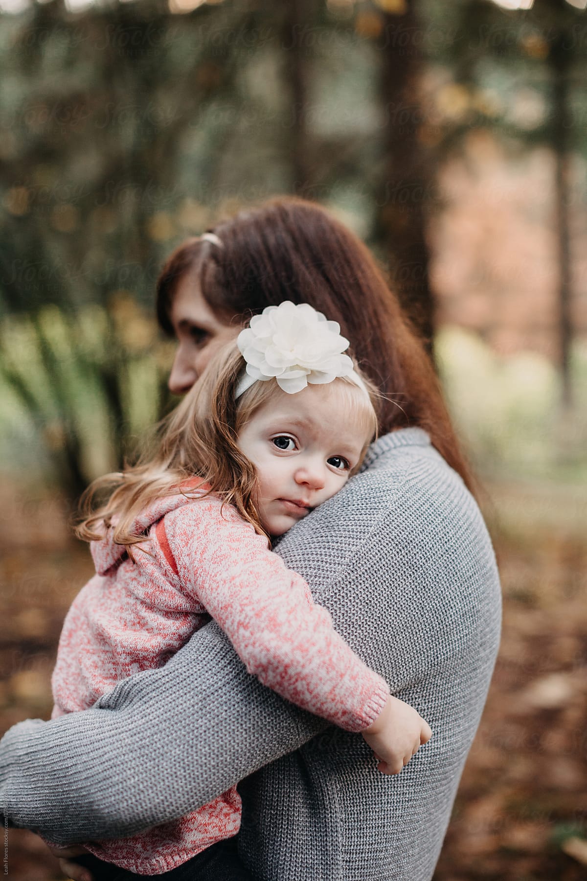 Mother Holding Little Daughter By Stocksy Contributor Leah Flores