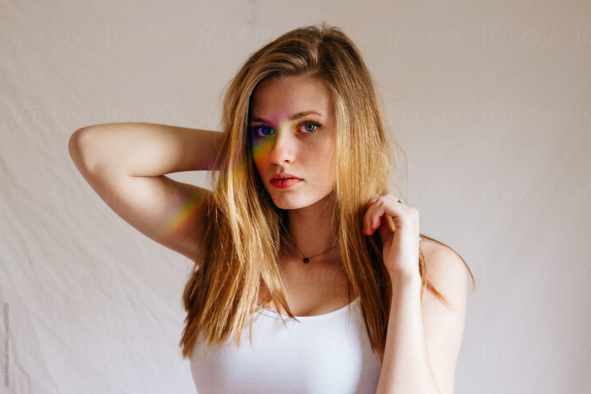 Young female model posing with rainbow stripe