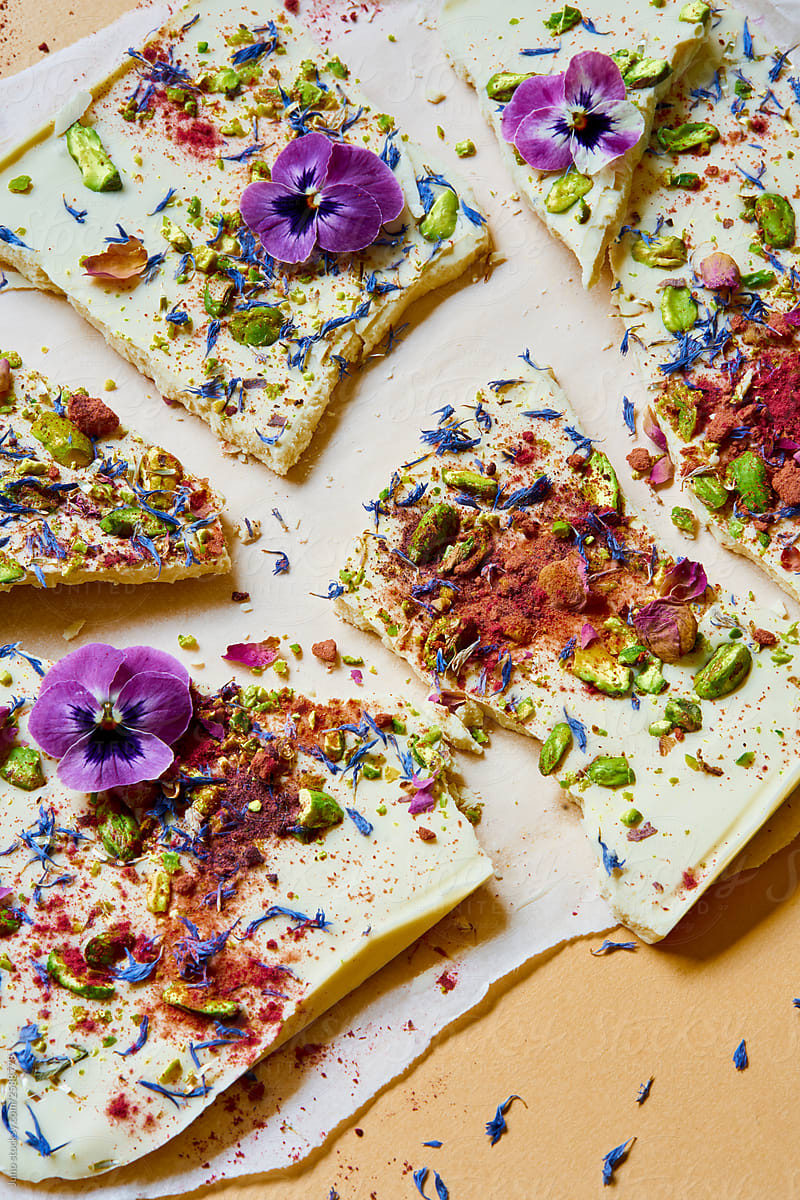 White chocolate bark with pistachios, berry powder, cannabis and flower petals
