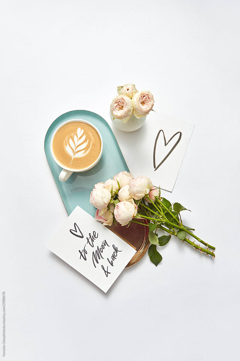 Greeting card with cappuccino cup and roses.