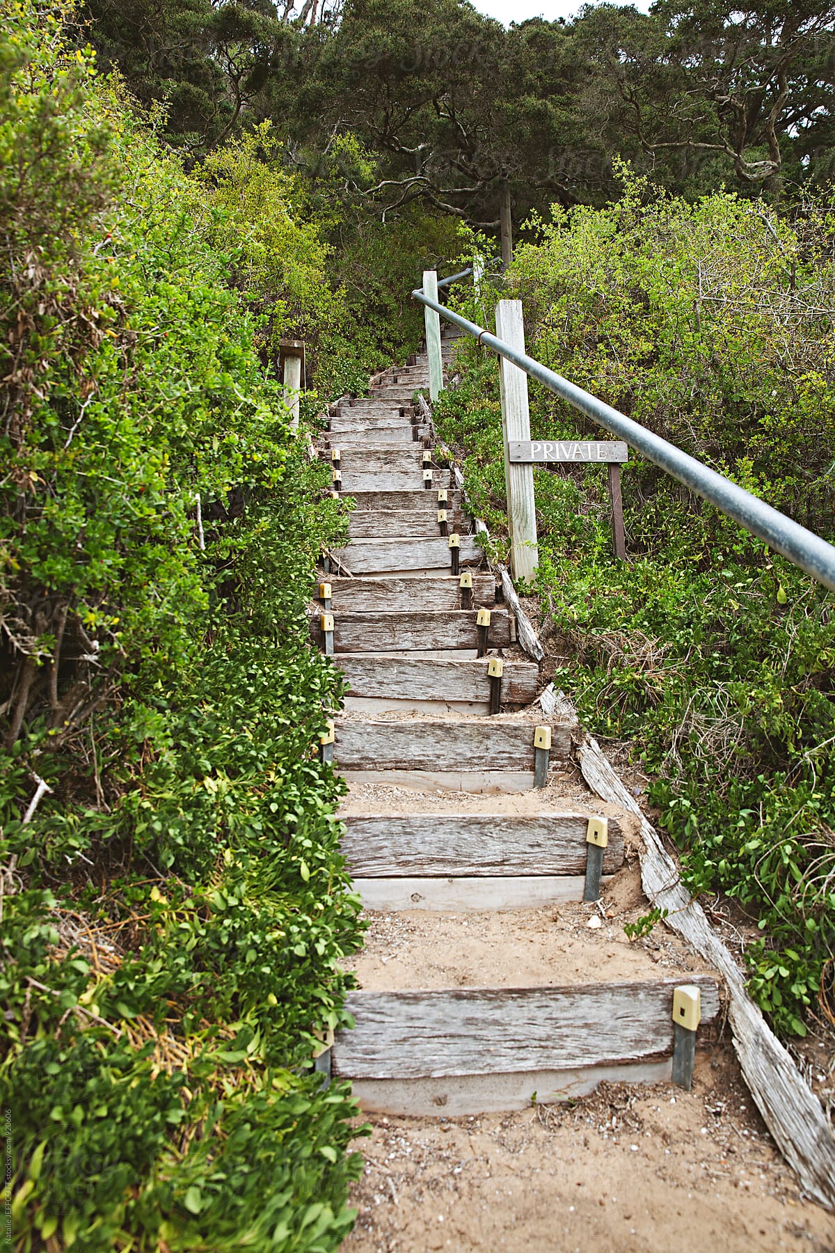 Stairs on the beach leading to a private property in Portsea, Victoria, Australia