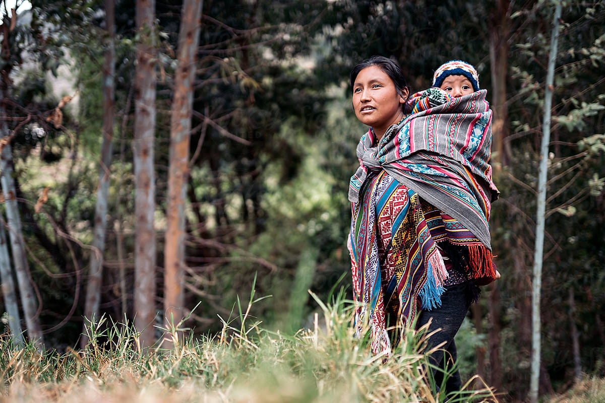 Mother With Her Son Walking Around In The Mountains