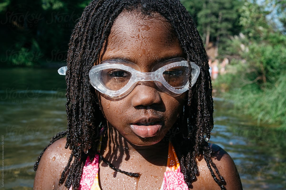 African American Girl With Swimming Goggle At A Beach By Stocksy Contributor Gabriel Gabi