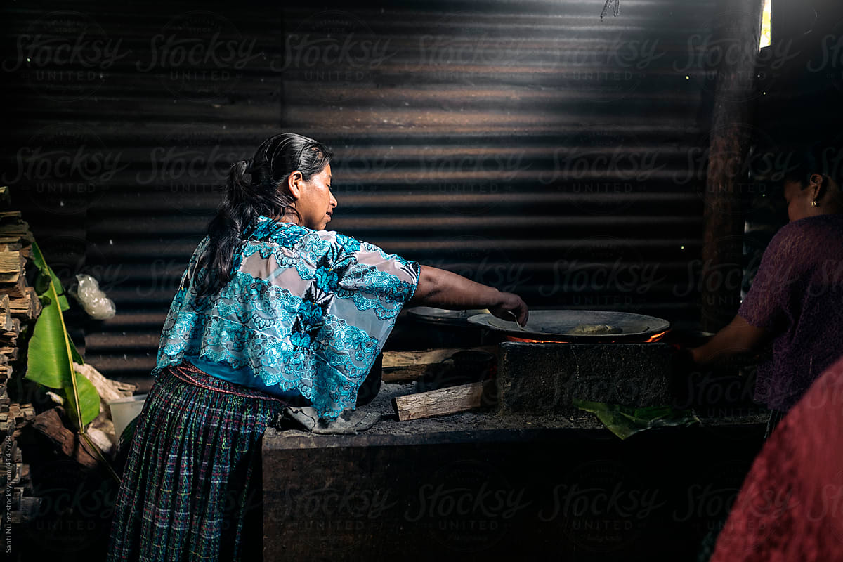 Young guatemalan woman preparing creole food