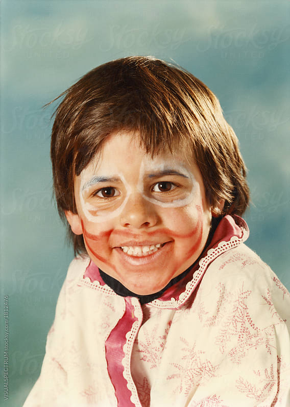 Vintage Film Headshot of Smiling Boy Wearing Carnival Makeup