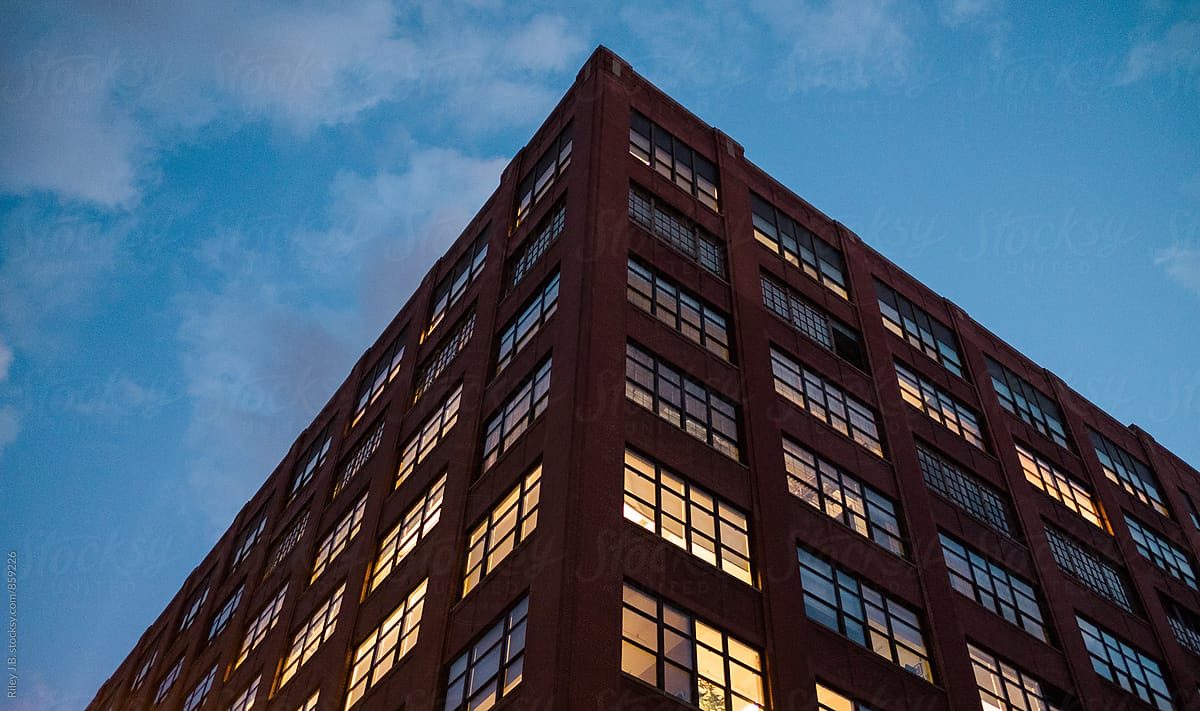 A warehouse type building at dusk.