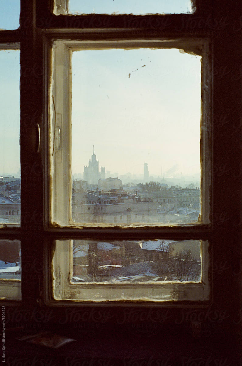 Old vintage wood window view framing the outside urban city skyline