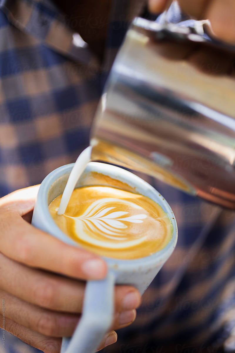 Barista making art latte