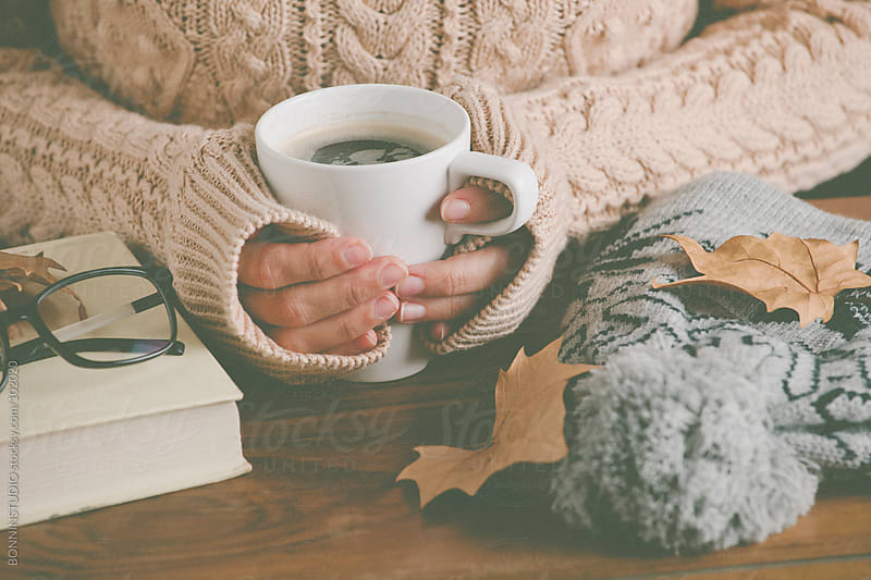 Cozy home. Woman warming up her hands with coffee mug. by BONNINSTUDIO ...