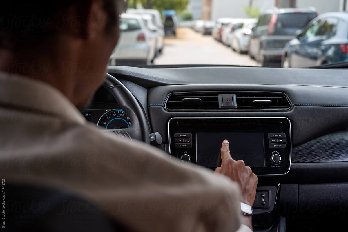 Black man Using GPS Navigator In Car