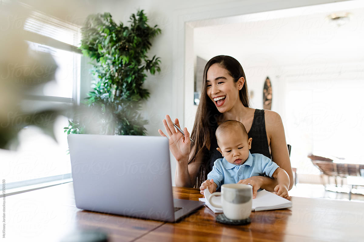 Woman Works from Home While Watching Baby