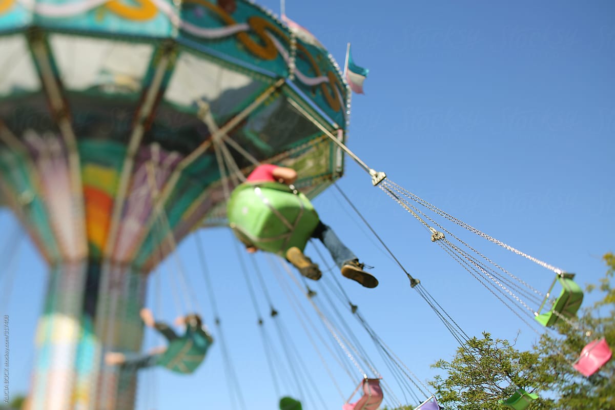 A Colorful Carnival Swing Ride On A Sunny Summer Afternoon