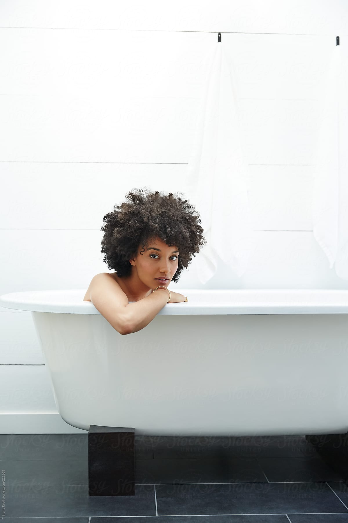 African American Woman Relaxing Taking A Bath By Stocksy Contributor