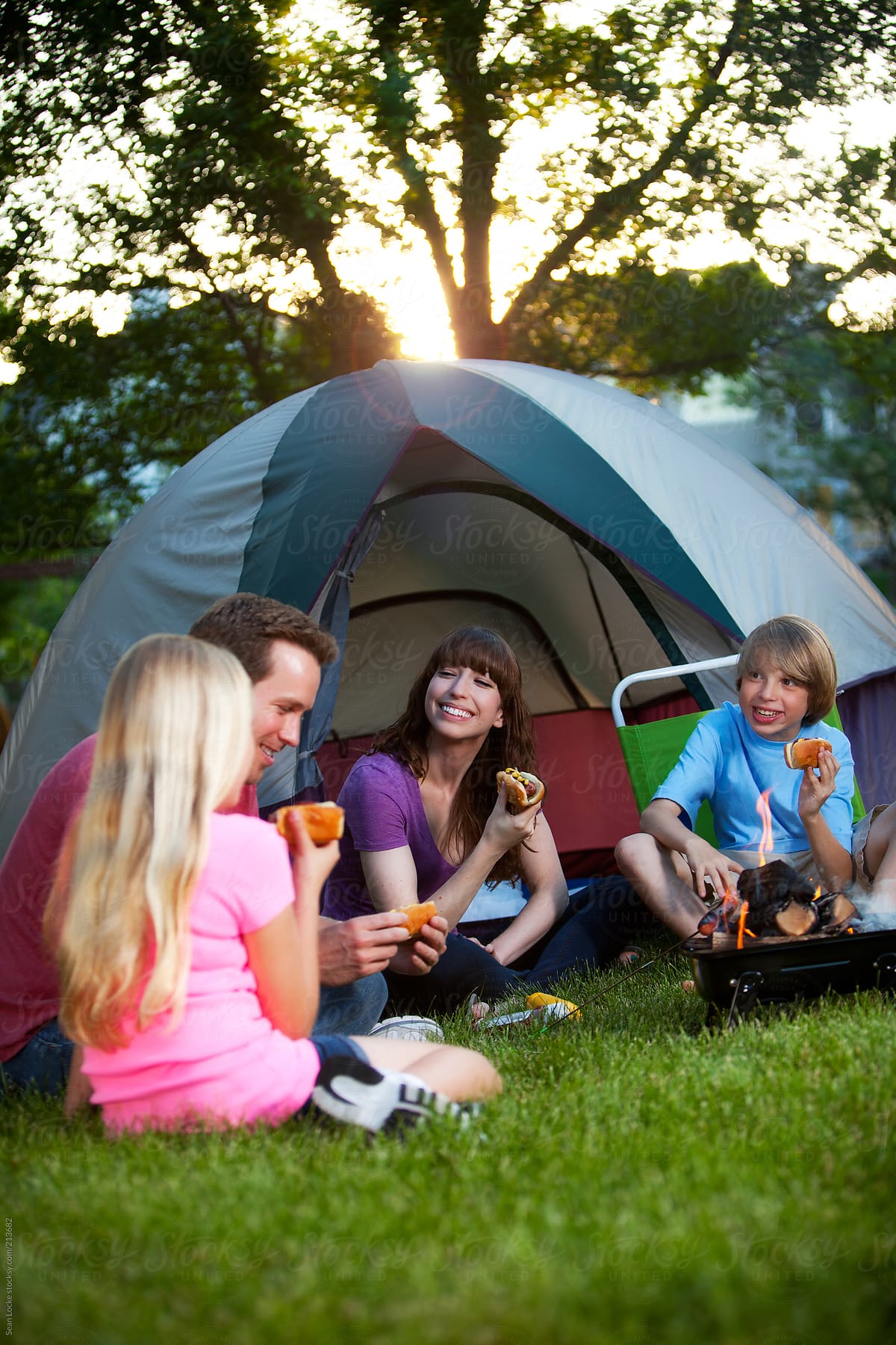 Camping: Family Eats Together By Backyard Tent