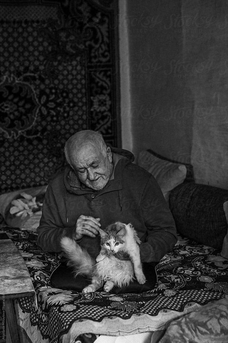 Physically Disabled Man Petting His Cat monochrome