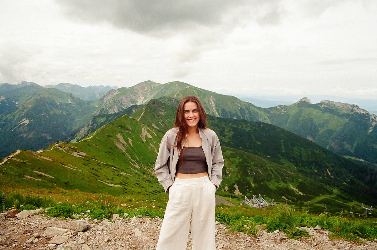 portrait  a woman tourist standing on the top of the Tatra, Poland