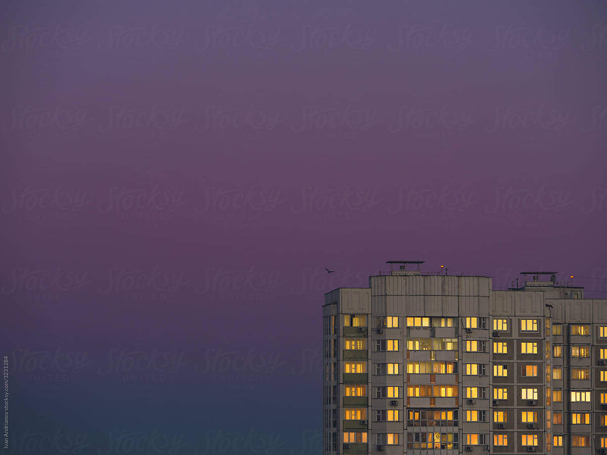 Apartment building with sunset reflection
