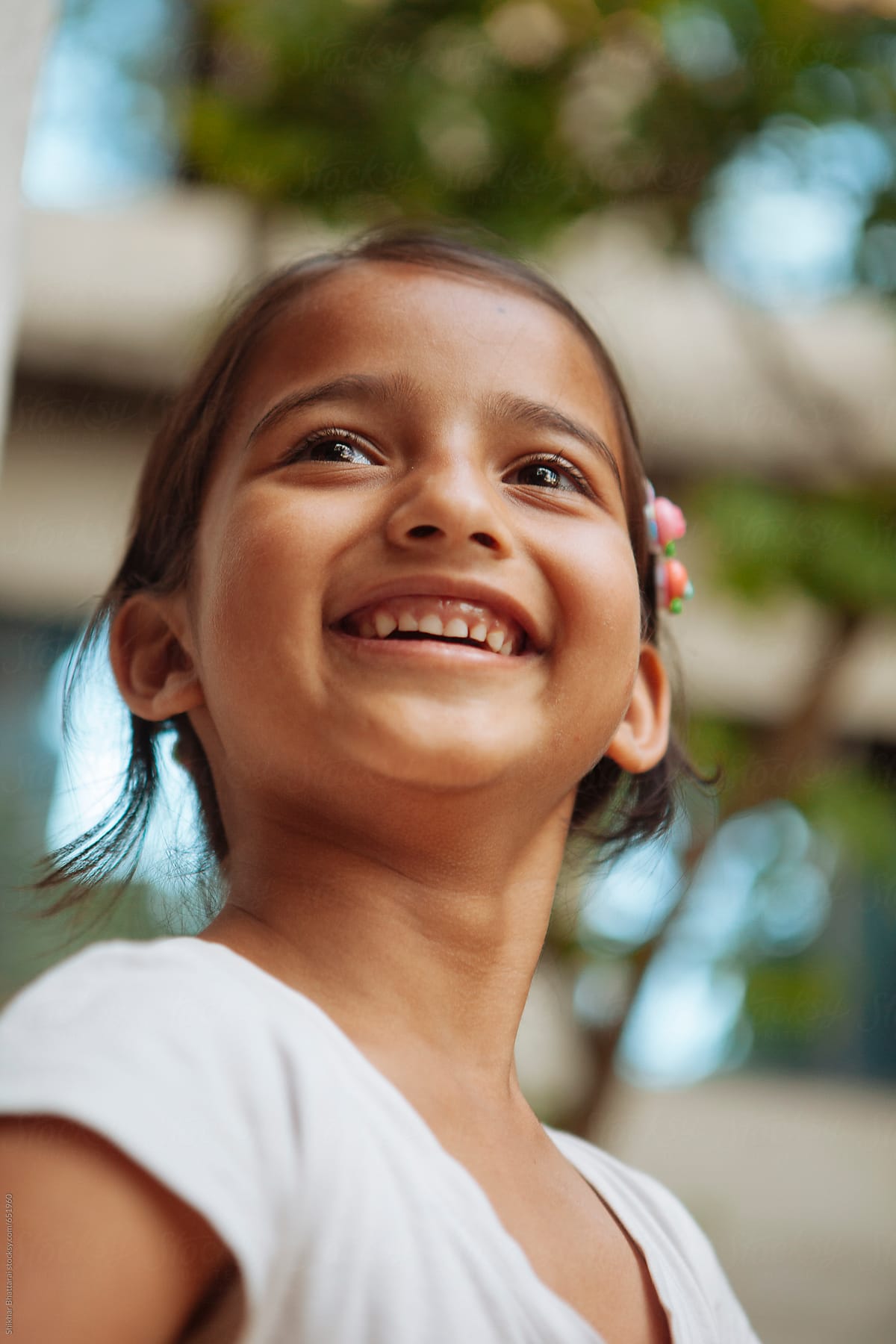 a-young-girl-with-a-beautiful-smile-by-stocksy-contributor-shikhar