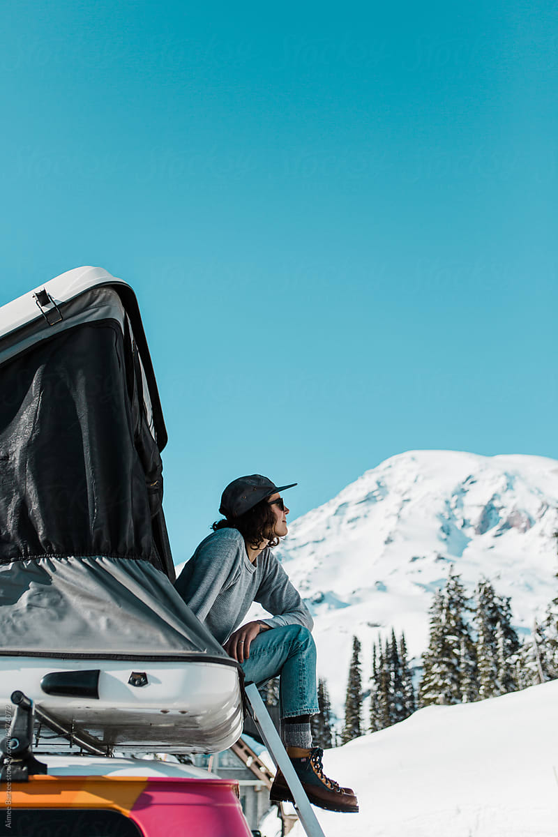 Woman Taking in Mountain Views in Pop Top Camper