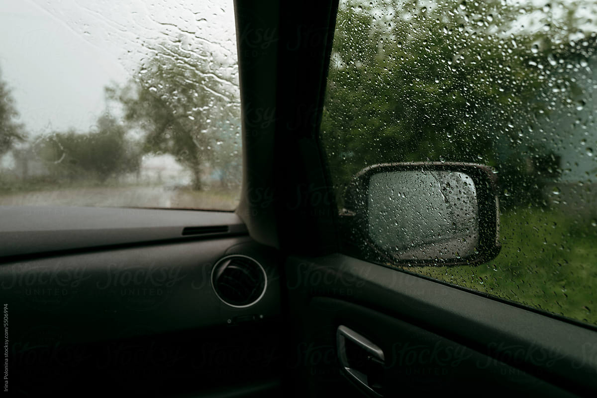 View of road from car during rain.