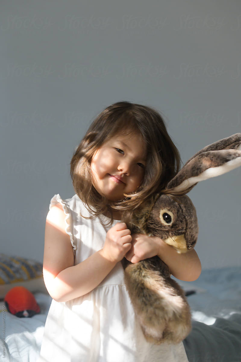 Little girl with stuffed animal