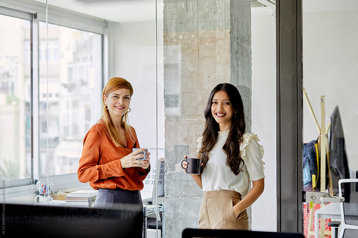 Female co-workers having coffee